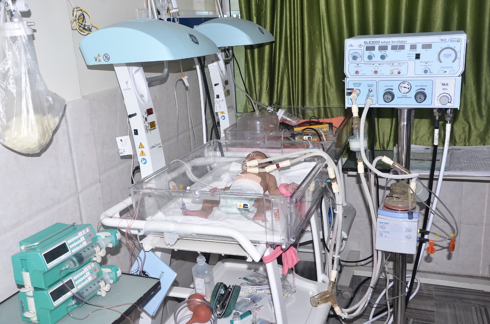 Neonatal Intensive Care Unit (NICU) at IDMH — infant in incubator with ventilator support
