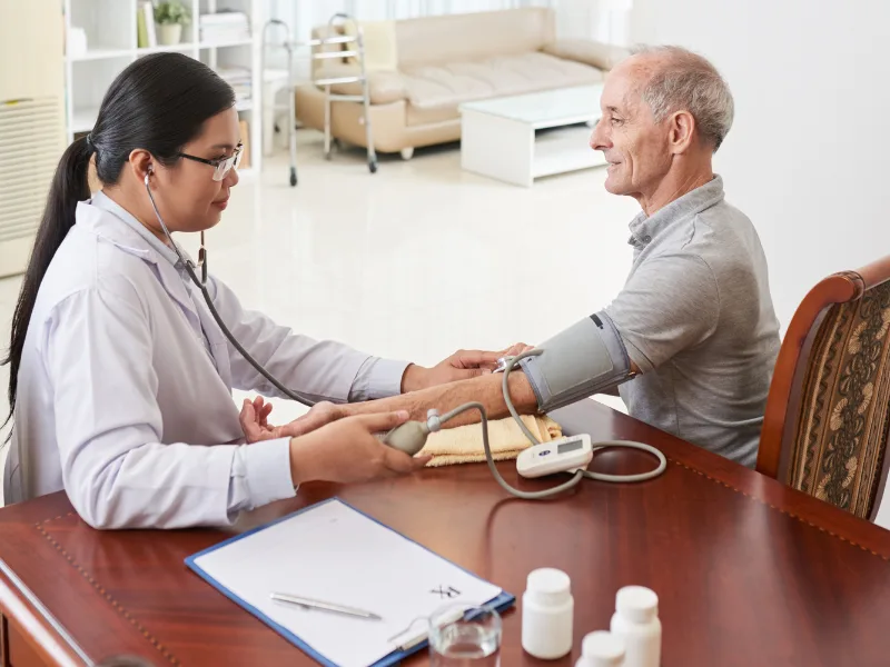 Senior neurophysician treating a patient for nerve weakness in Patna.