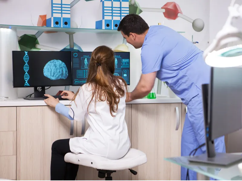 Senior neurosurgeon analyzing brain scans at IDMH Patna.